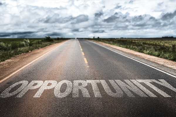 road with opportunity painted on it