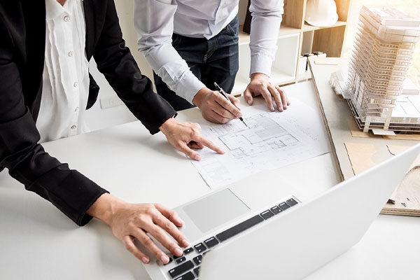 workers drafting blueprints
